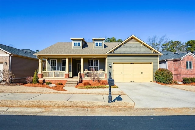 view of front of property with a garage and covered porch