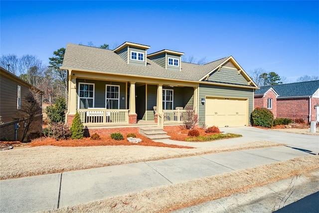 craftsman-style house with a porch and a garage