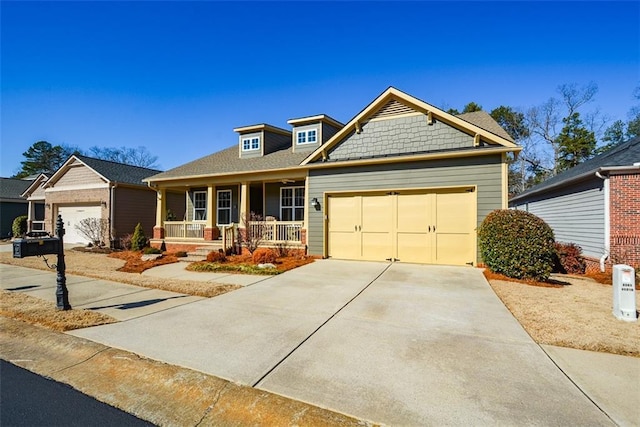 craftsman-style home with a porch and a garage