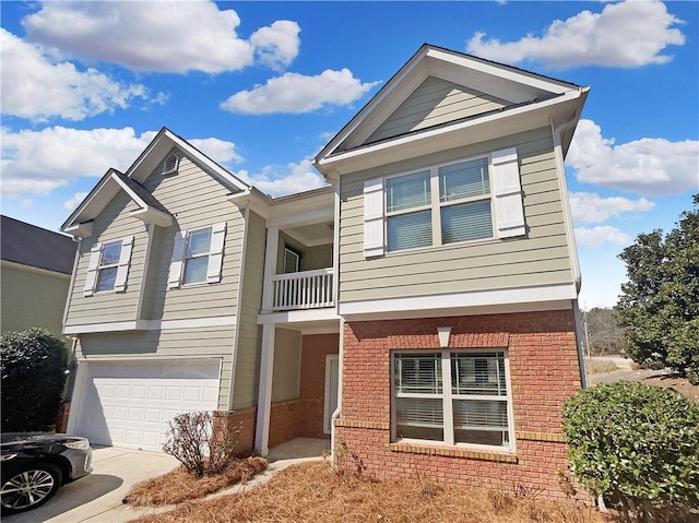 view of front of house featuring a garage, driveway, brick siding, and a balcony