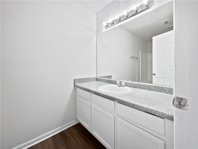 25 Timber Ridge Dr, Cartersville, GA 30121 - bathroom featuring wood finished floors, vanity, and baseboards