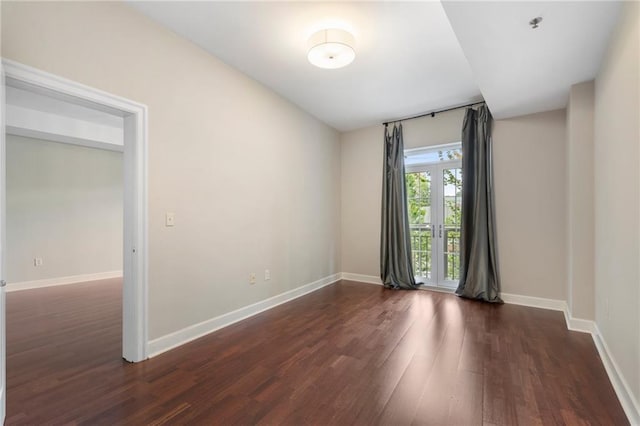 325 E Paces Ferry Rd NE Unit 313, Atlanta, GA 30305 - empty room featuring dark wood-style floors and baseboards