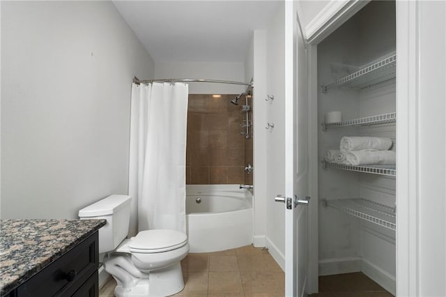 325 E Paces Ferry Rd NE Unit 313, Atlanta, GA 30305 - bathroom with tile patterned flooring, shower / bathtub combination with curtain, vanity, toilet, and baseboards