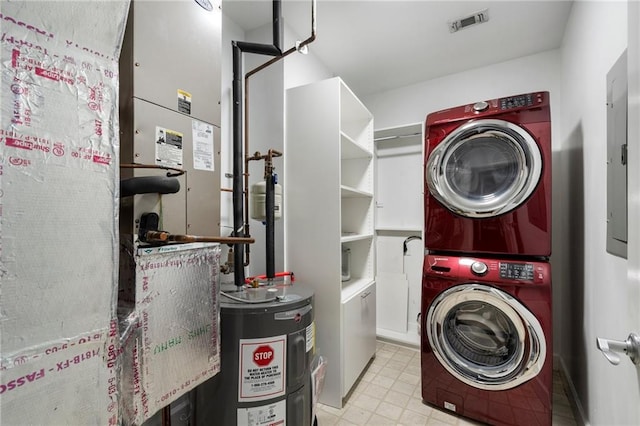 325 E Paces Ferry Rd NE Unit 313, Atlanta, GA 30305 - laundry area with estacked washer and dryer, water heater, heating unit, and electric panel