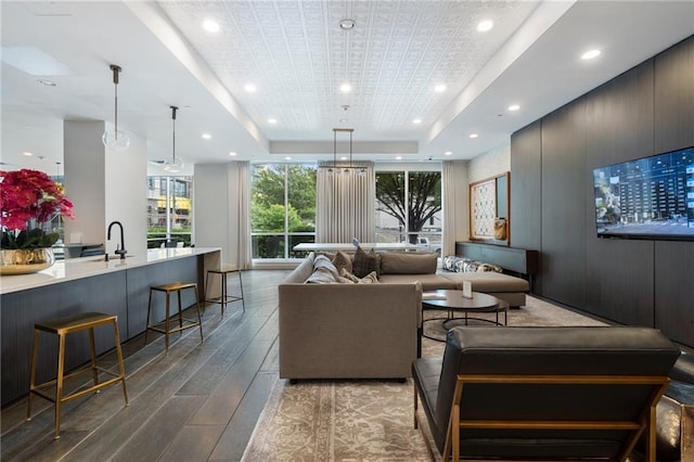 325 E Paces Ferry Rd NE Unit 313, Atlanta, GA 30305 - living area with wood-type flooring, a tray ceiling, and recessed lighting