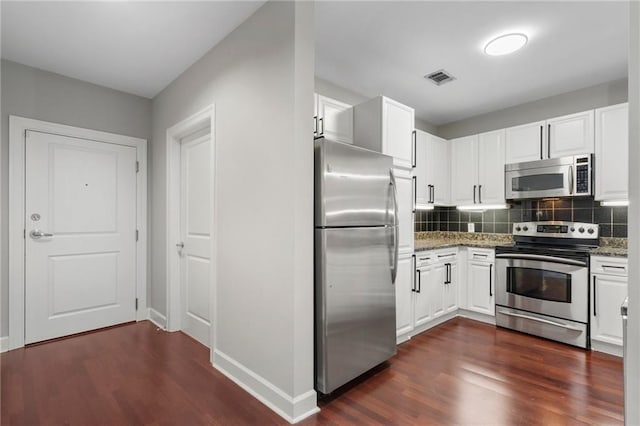 325 E Paces Ferry Rd NE Unit 313, Atlanta, GA 30305 - kitchen with stainless steel appliances, dark wood-type flooring, decorative backsplash, and white cabinetry