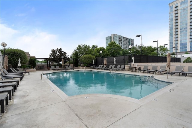 325 E Paces Ferry Rd NE Unit 313, Atlanta, GA 30305 - community pool featuring a patio area