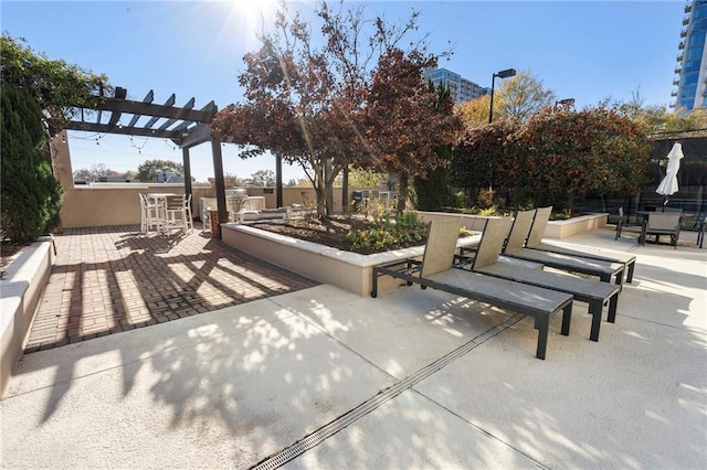 325 E Paces Ferry Rd NE Unit 313, Atlanta, GA 30305 - view of patio / terrace with a pergola and outdoor dining area