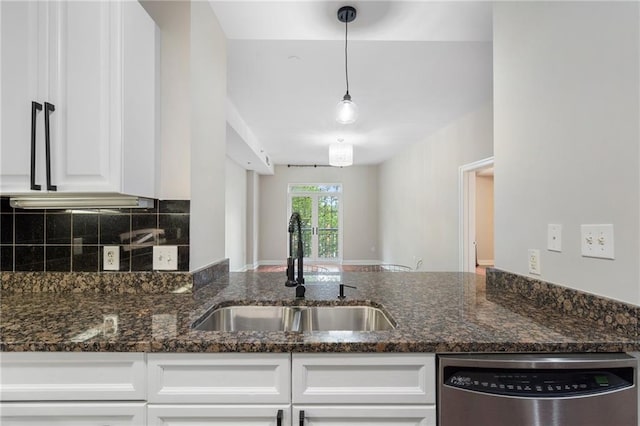325 E Paces Ferry Rd NE Unit 313, Atlanta, GA 30305 - kitchen featuring a sink, stainless steel dishwasher, white cabinetry, decorative backsplash, and dark stone counters