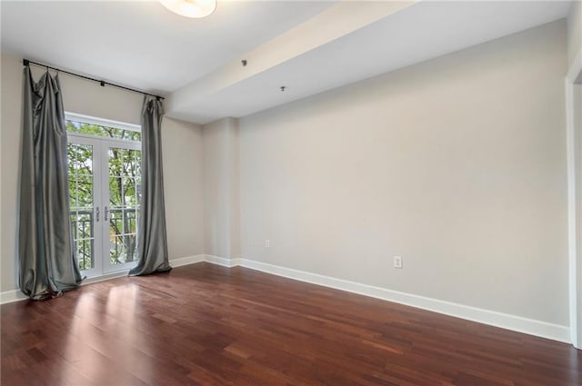 325 E Paces Ferry Rd NE Unit 313, Atlanta, GA 30305 - empty room with baseboards and dark wood finished floors