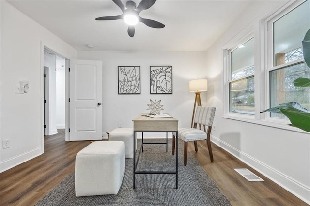 office area with ceiling fan and dark hardwood / wood-style flooring