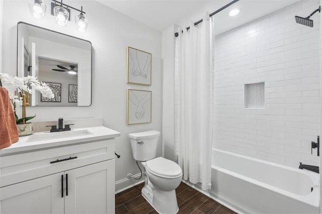 full bathroom featuring vanity, shower / bath combination with curtain, and toilet