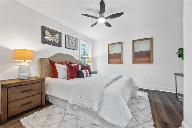 bedroom featuring ceiling fan and dark hardwood / wood-style flooring