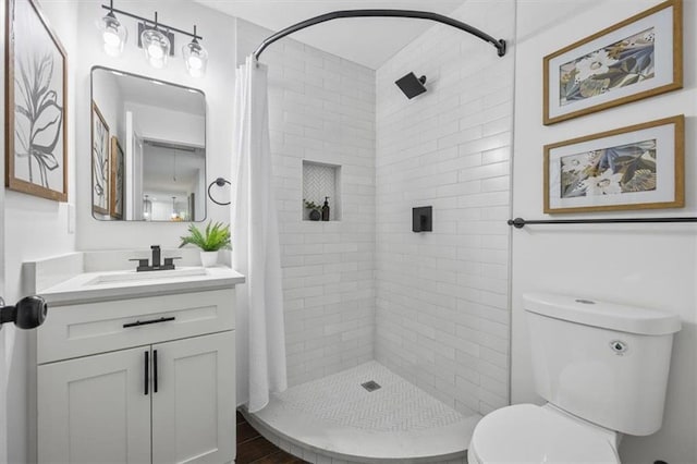 bathroom with a shower with curtain, vanity, and toilet