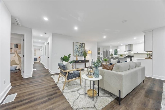 living room featuring dark hardwood / wood-style flooring