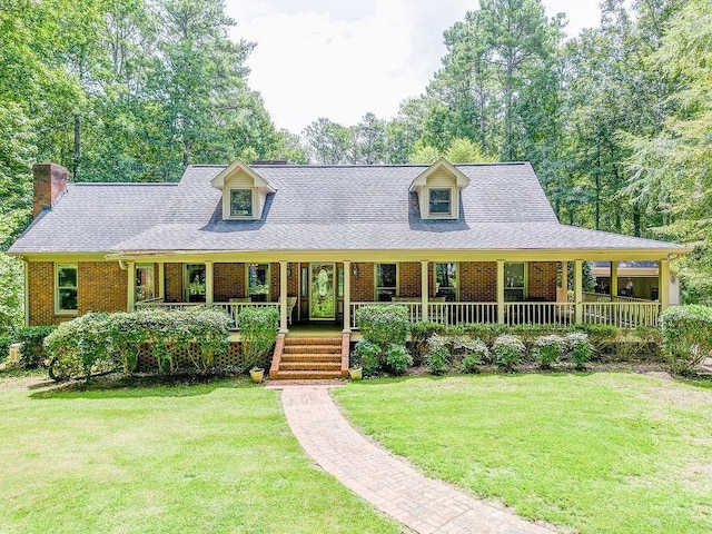 view of front facade with covered porch and a front lawn