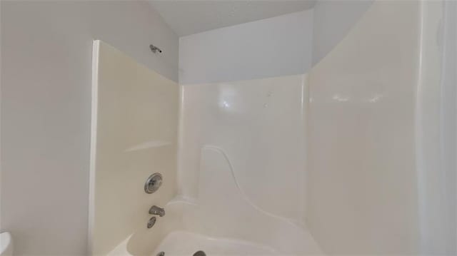 bathroom with shower / tub combination