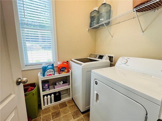 laundry area with laundry area and washing machine and clothes dryer