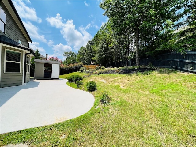 view of yard featuring fence and a patio