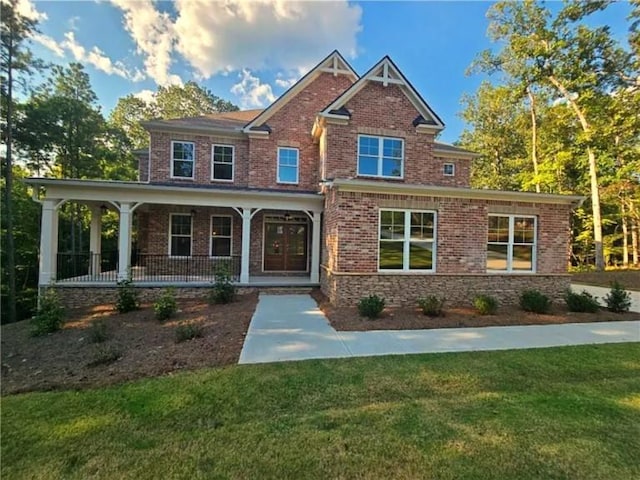 7580 Sunridge Ln, Douglasville, GA 30135 - craftsman-style home with covered porch, a front lawn, and brick siding
