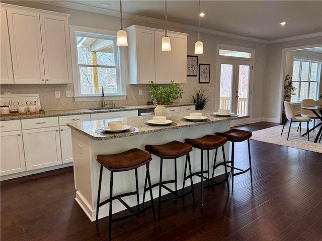 7580 Sunridge Ln, Douglasville, GA 30135 - kitchen with backsplash, dark wood-style flooring, a sink, and ornamental molding