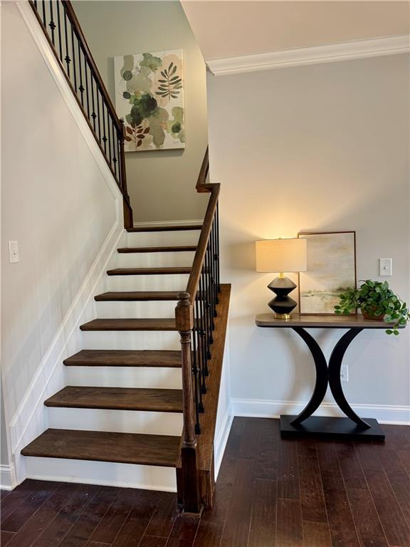 7580 Sunridge Ln, Douglasville, GA 30135 - stairway featuring baseboards and hardwood / wood-style flooring