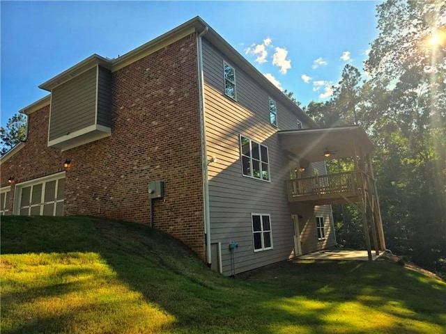 7580 Sunridge Ln, Douglasville, GA 30135 - rear view of house with a lawn, brick siding, a garage, and a wooden deck