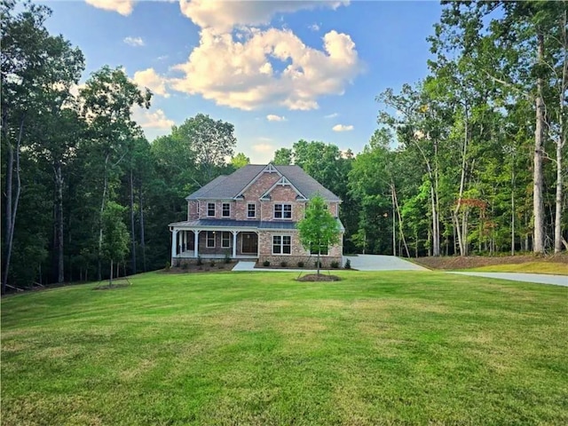 7580 Sunridge Ln, Douglasville, GA 30135 - view of front of property with brick siding, a wooded view, and a front lawn