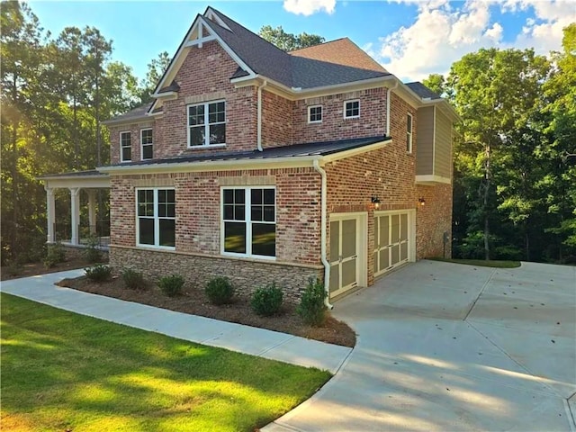 7580 Sunridge Ln, Douglasville, GA 30135 - view of front of house with a front lawn, driveway, a garage, and brick siding