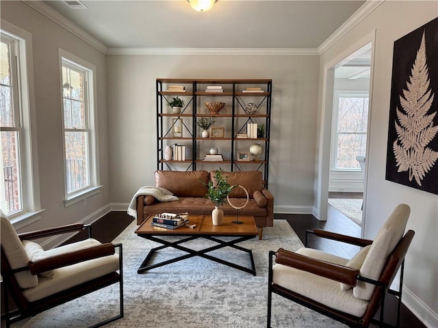 7580 Sunridge Ln, Douglasville, GA 30135 - sitting room featuring baseboards, wood finished floors, and crown molding