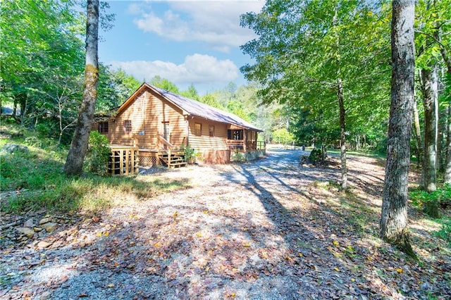 view of yard featuring an outdoor fire pit and a patio