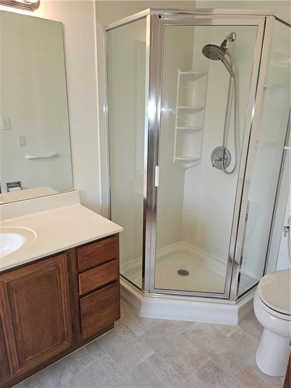 2752 Inverloch Cir, Duluth, GA 30096 - bathroom with toilet, a stall shower, vanity, and tile patterned flooring
