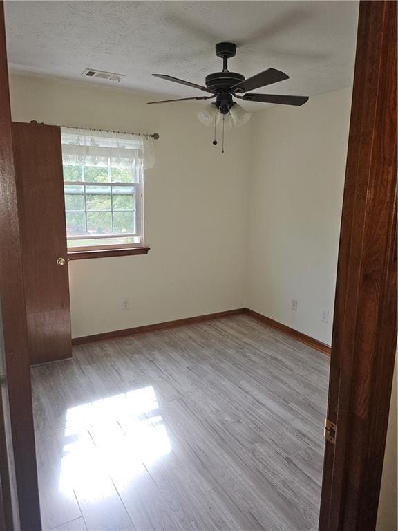 2752 Inverloch Cir, Duluth, GA 30096 - unfurnished room with a ceiling fan, wood finished floors, and baseboards