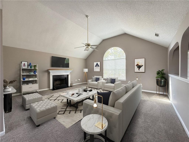 living room with ceiling fan, lofted ceiling, light carpet, and a textured ceiling