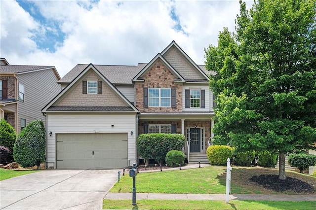 558 Olympic Way, Acworth, GA 30102 - craftsman-style house featuring driveway, a front lawn, and stone siding