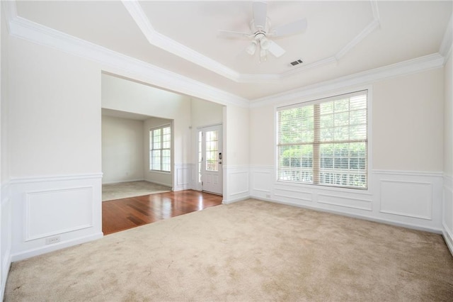558 Olympic Way, Acworth, GA 30102 - carpeted spare room featuring a wainscoted wall, a raised ceiling, ornamental molding, ceiling fan, and a decorative wall