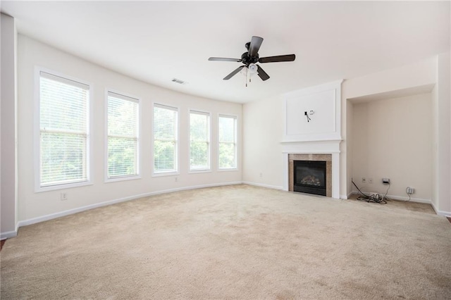 558 Olympic Way, Acworth, GA 30102 - unfurnished living room featuring plenty of natural light, light colored carpet, a fireplace, and ceiling fan