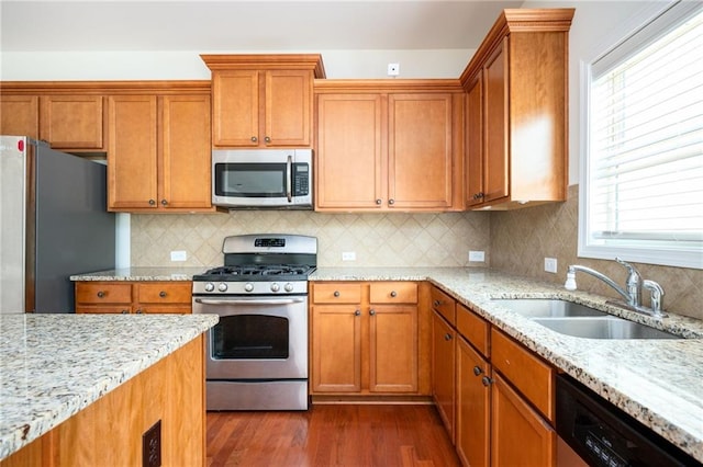 558 Olympic Way, Acworth, GA 30102 - kitchen with appliances with stainless steel finishes, dark wood-type flooring, plenty of natural light, and light stone counters