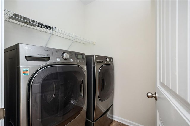 558 Olympic Way, Acworth, GA 30102 - washroom featuring independent washer and dryer and baseboards