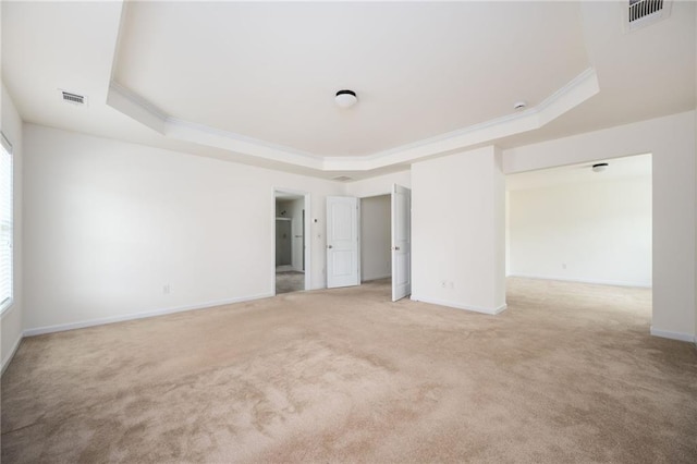 558 Olympic Way, Acworth, GA 30102 - unfurnished bedroom with a tray ceiling, light colored carpet, multiple windows, and crown molding