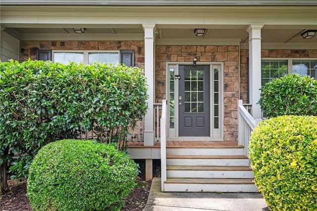 558 Olympic Way, Acworth, GA 30102 - view of exterior entry with covered porch and stone siding