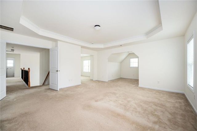 558 Olympic Way, Acworth, GA 30102 - empty room featuring a tray ceiling, light colored carpet, healthy amount of natural light, and ornamental molding