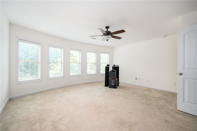 558 Olympic Way, Acworth, GA 30102 - unfurnished living room with light colored carpet and a ceiling fan