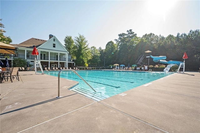 558 Olympic Way, Acworth, GA 30102 - community pool featuring a water slide and a patio area
