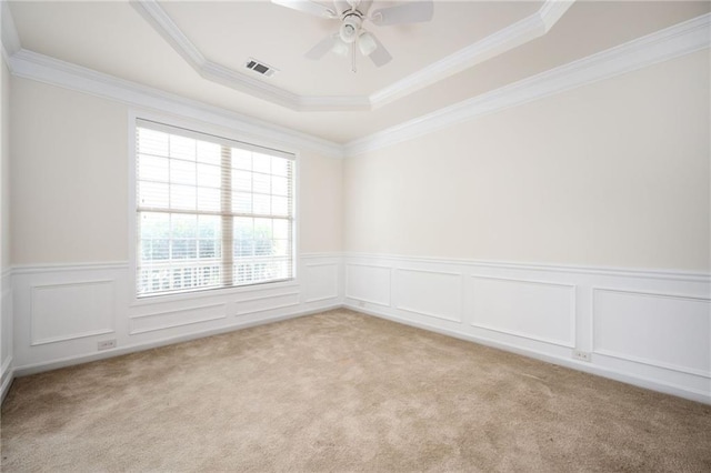 558 Olympic Way, Acworth, GA 30102 - empty room featuring light colored carpet, a raised ceiling, wainscoting, a ceiling fan, and crown molding
