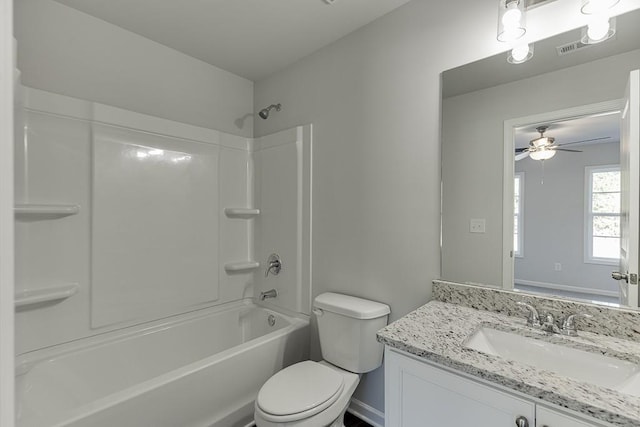 full bathroom featuring toilet, ceiling fan, shower / bathtub combination, and vanity