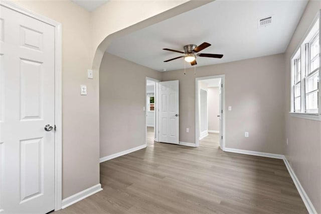 spare room featuring light hardwood / wood-style floors and ceiling fan