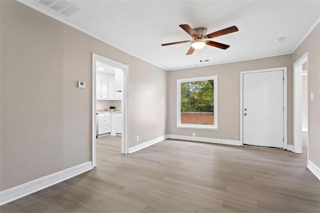 spare room featuring ceiling fan and light wood-type flooring