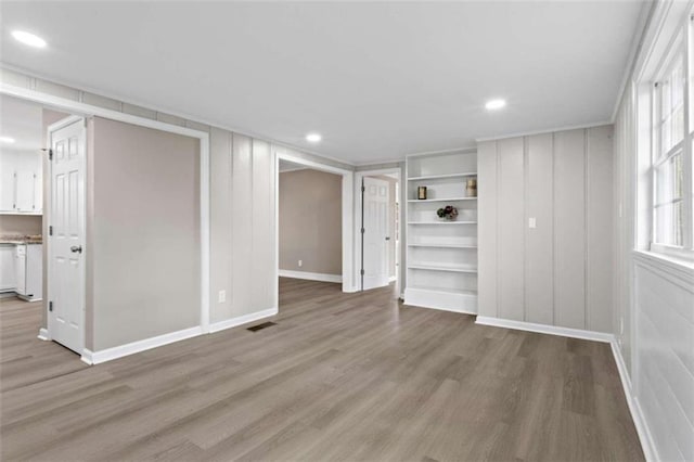 unfurnished living room with light hardwood / wood-style floors