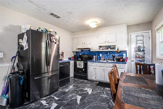 2087 Chestnut Way, Lithia Springs, GA 30122 - kitchen featuring freestanding refrigerator, black range with electric stovetop, dark marble finish flooring, under cabinet range hood, and white cabinets